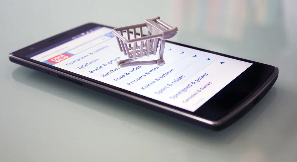 Smartphone with a small shopping cart on the screen
